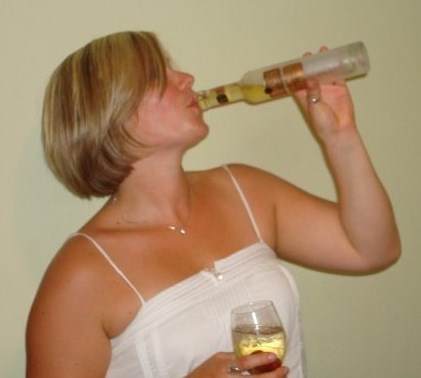Drinking from a bottle - Letting Go of Addiction - KW Professional Organizers